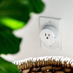 Voltson Smart WiFi Outlet (10A) - Etekcity Voltson Smart Wi-Fi Outlet plugged into a wall 