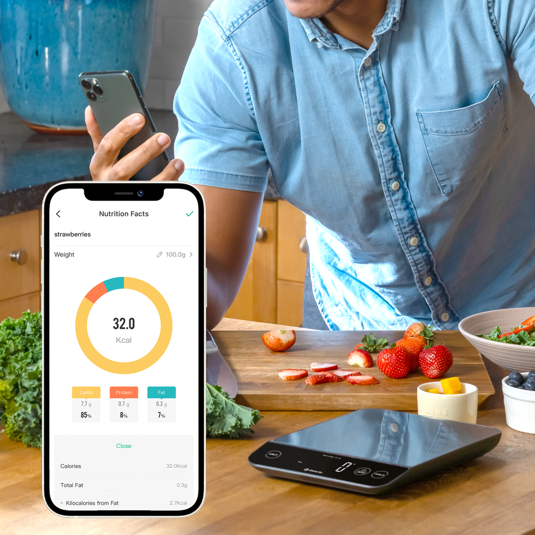 A person viewing nutrition facts on the VeSync app next to the Etekcity Luminary™ Smart Nutrition Scale