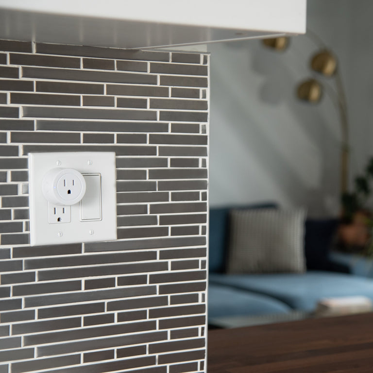 Etekcity Voltson Mini Smart Wi-Fi Outlet Plug plugged into a wall