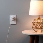 A lamp plugged into an Etekcity Voltson Mini Smart Wi-Fi Outlet Plug