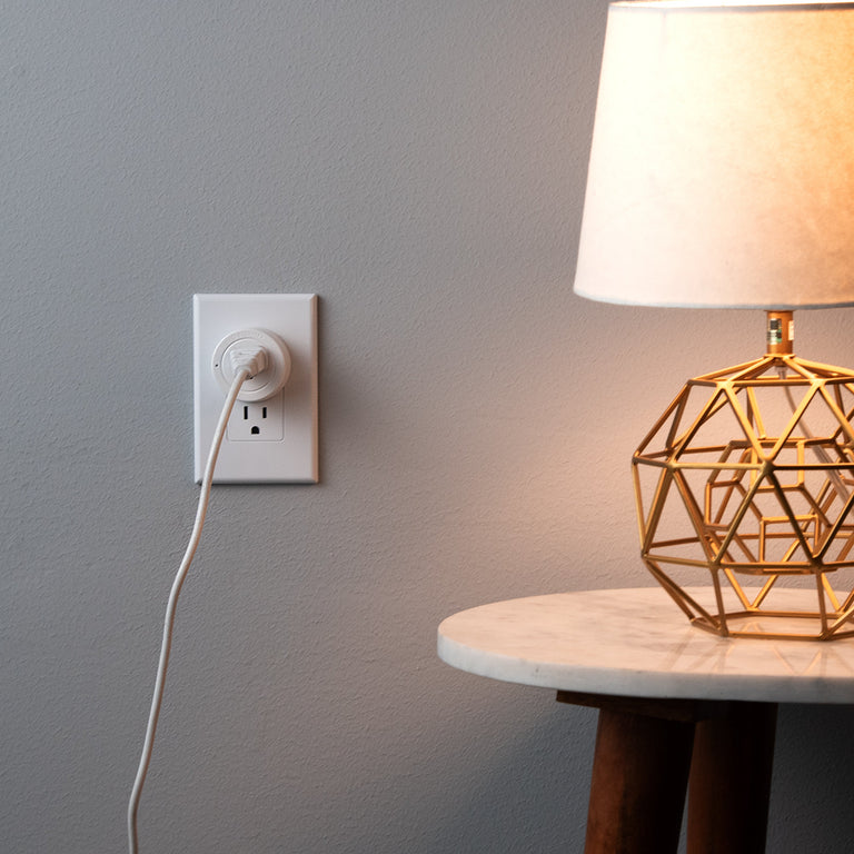 A lamp plugged into an Etekcity Voltson Mini Smart Wi-Fi Outlet Plug