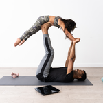 A couple doing yoga next to the Etekcity HR Smart Fitness Scale 
