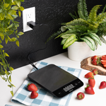 Etekcity Luminary™ Kitchen Scale being charged by an outlet 